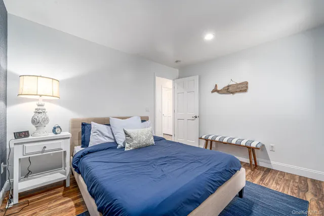 a bedroom with a bed and a lamp