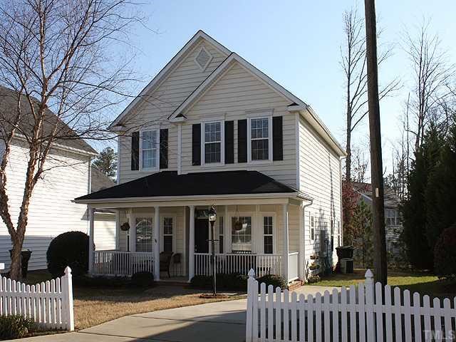 4824 Morning Edge Drive Raleigh, NC 27613 - Photo 1 of 12 a front view of a house with garden