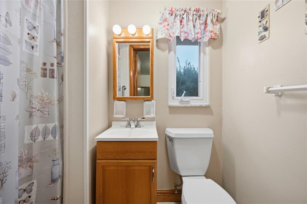 108 Starling Drive McKees Rocks, PA 15136 - Photo 15 of 37 a bathroom with a toilet sink and mirror