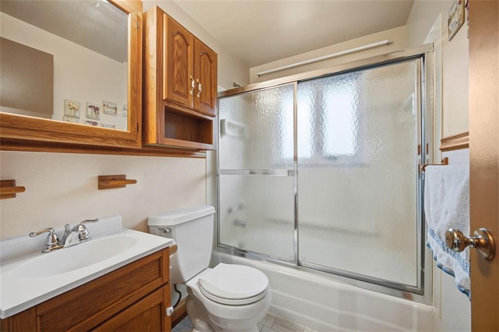 108 Starling Drive McKees Rocks, PA 15136 - Photo 19 of 37 a bathroom with a granite countertop sink toilet and shower