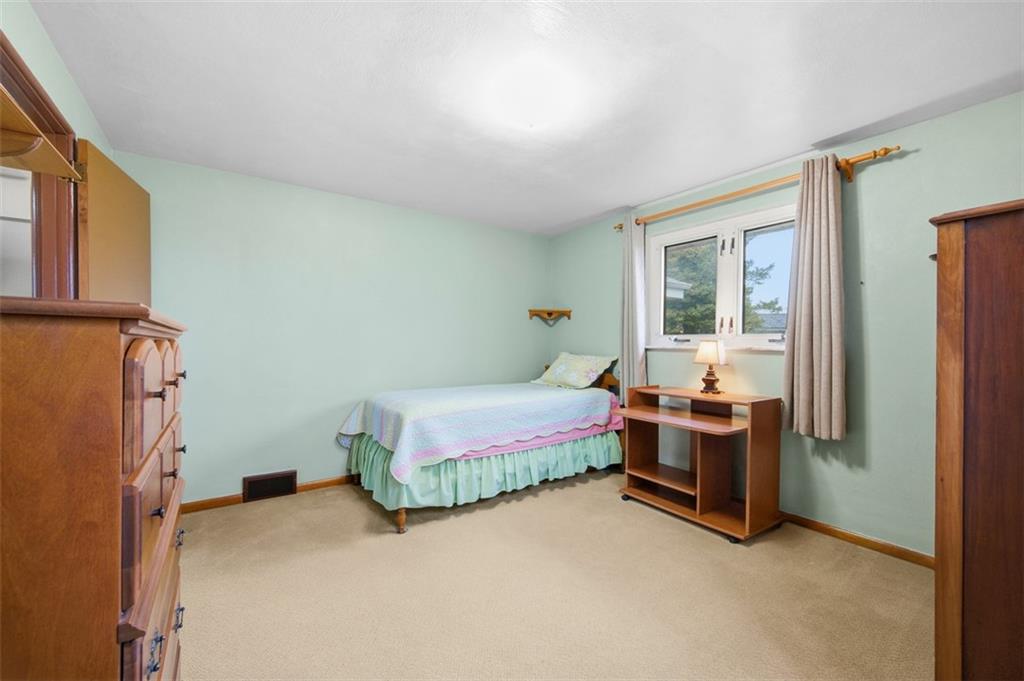 108 Starling Drive McKees Rocks, PA 15136 - Photo 20 of 37 a bedroom with bed and a window