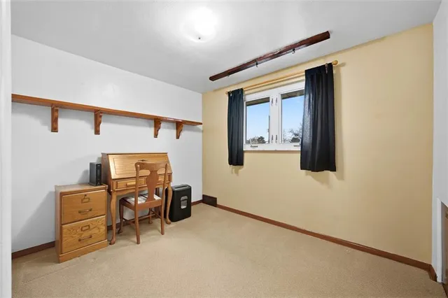 a view of workspace with wooden floor and windows