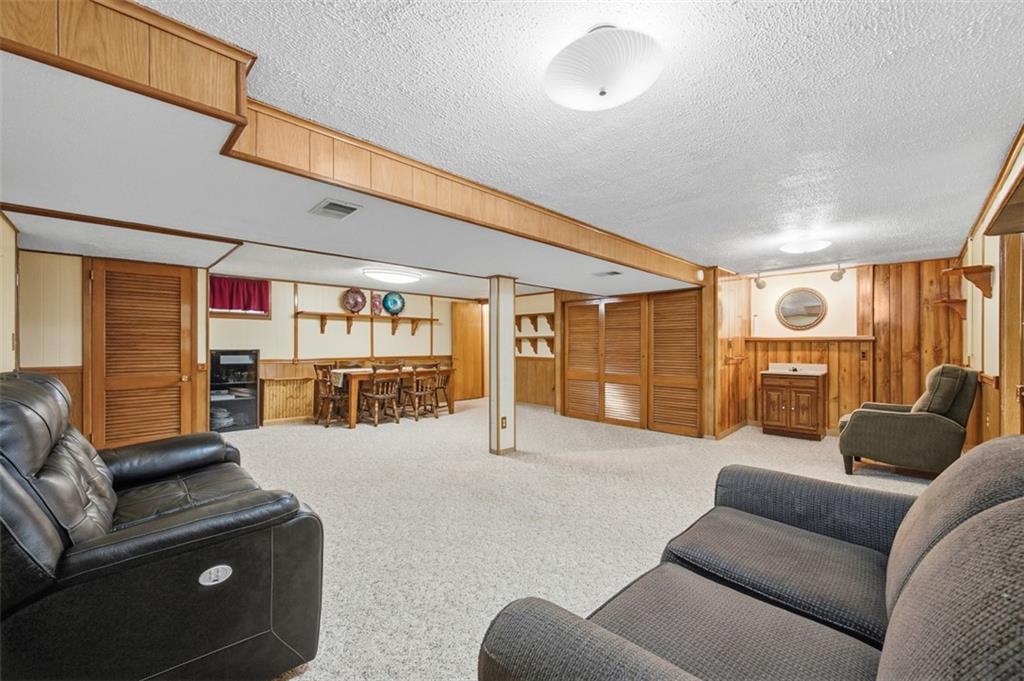 108 Starling Drive McKees Rocks, PA 15136 - Photo 28 of 37 a living room with furniture gym equipment and a large window