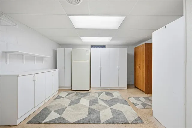 a view of a room with wooden floor and white doors