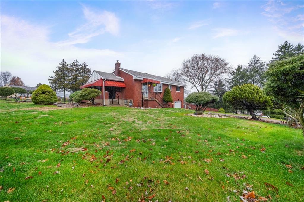 108 Starling Drive McKees Rocks, PA 15136 - Photo 3 of 37 a front view of house with garden
