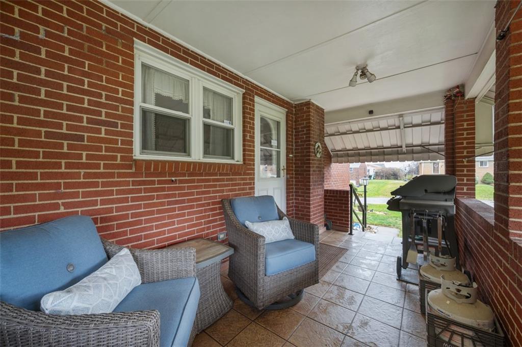 108 Starling Drive McKees Rocks, PA 15136 - Photo 33 of 37 a balcony with furniture and a potted plant