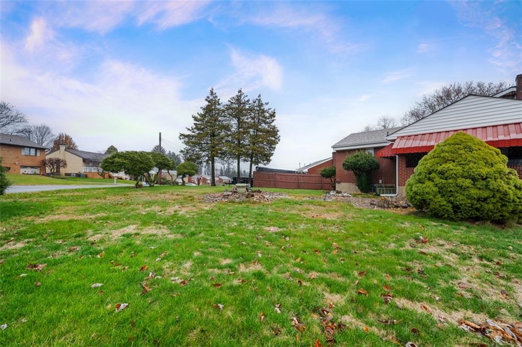 108 Starling Drive McKees Rocks, PA 15136 - Photo 34 of 37 a view of a garden with plants and trees
