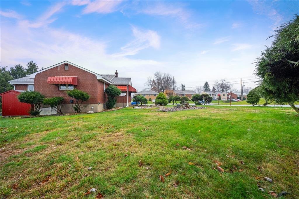 108 Starling Drive McKees Rocks, PA 15136 - Photo 35 of 37 a front view of a house with garden