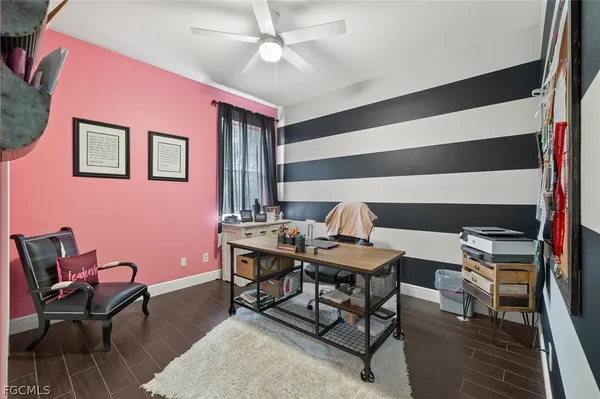 a workspace with furniture and wooden floor