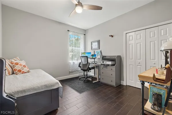 a bedroom with a bed and a table in it