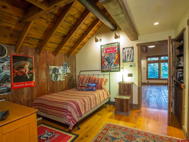a view of a room with wooden floor and windows