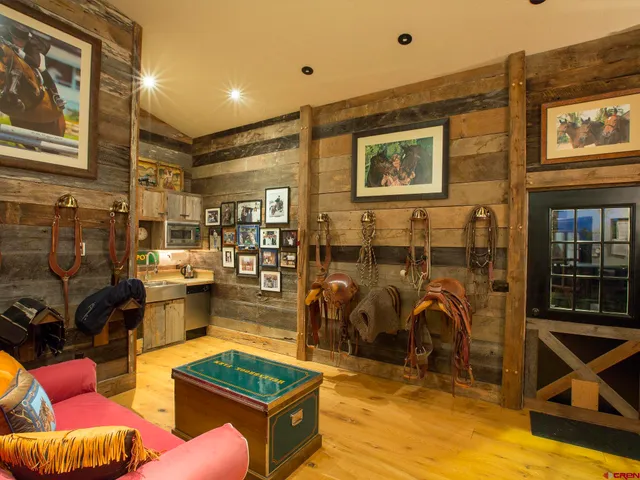 an aerial view of a houses with swimming pool