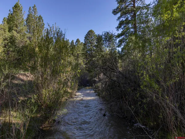 a view of swimming pool with an outdoor seating