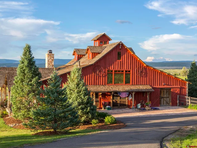 a outdoor living space with patio furniture and a chandelier