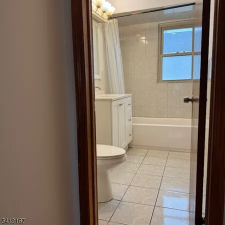a bathroom with a tub and a shower