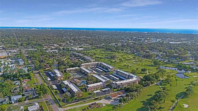 an aerial view of a house with a ocean view