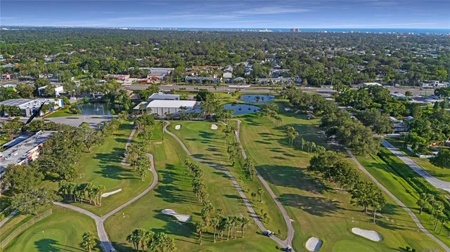 an aerial view of a residential houses with outdoor space