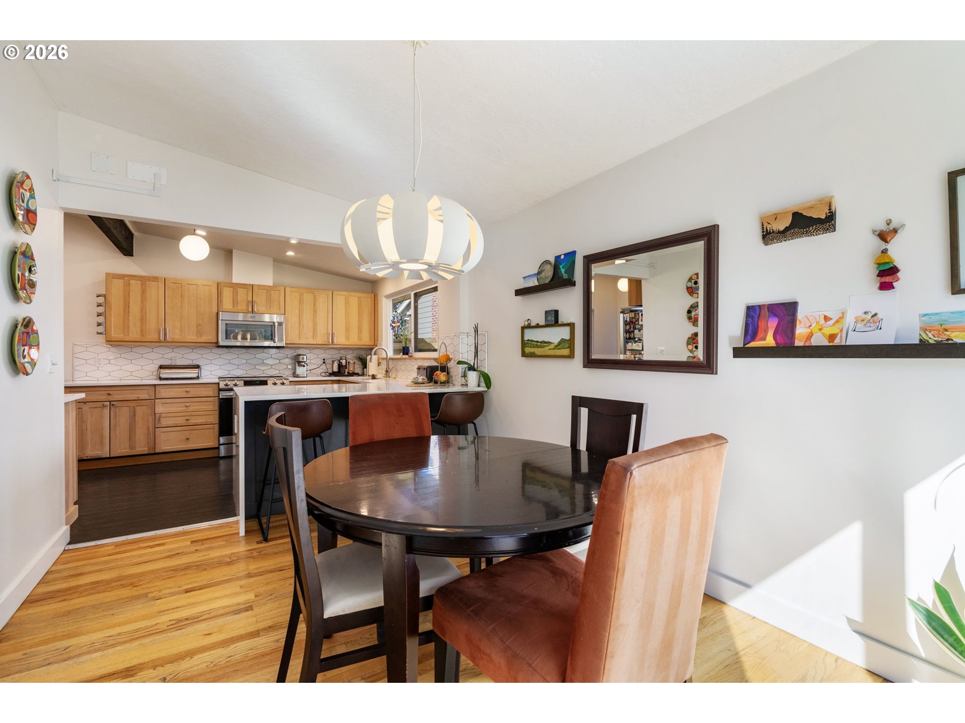 13410 Northwest Overton Street Portland, OR 97229 - Photo 13 of 48 a view of a dining room with furniture and wooden floor