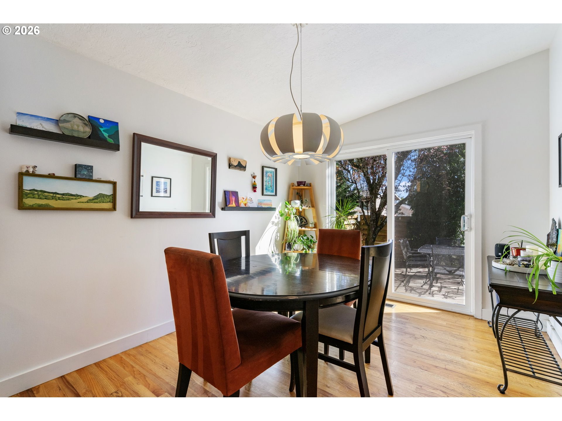 13410 Northwest Overton Street Portland, OR 97229 - Photo 14 of 48 a view of a dining room with furniture window and wooden floor