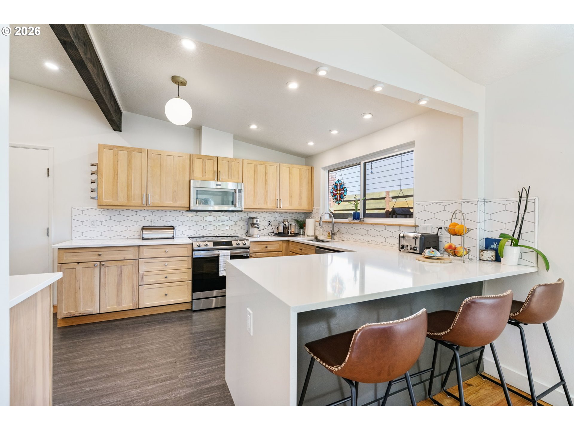 13410 Northwest Overton Street Portland, OR 97229 - Photo 15 of 48 a kitchen with a sink cabinets and wooden floor