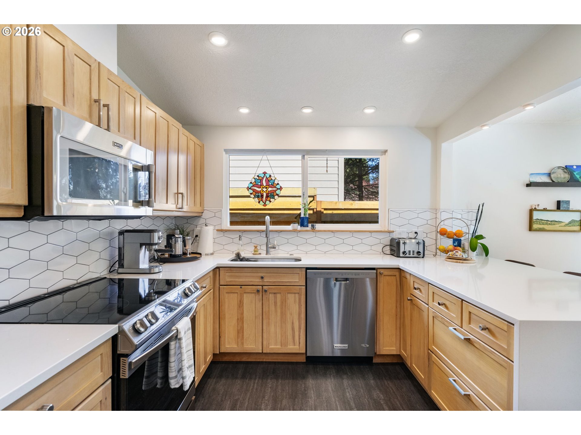 13410 Northwest Overton Street Portland, OR 97229 - Photo 17 of 48 a kitchen that has a sink and a stove in it