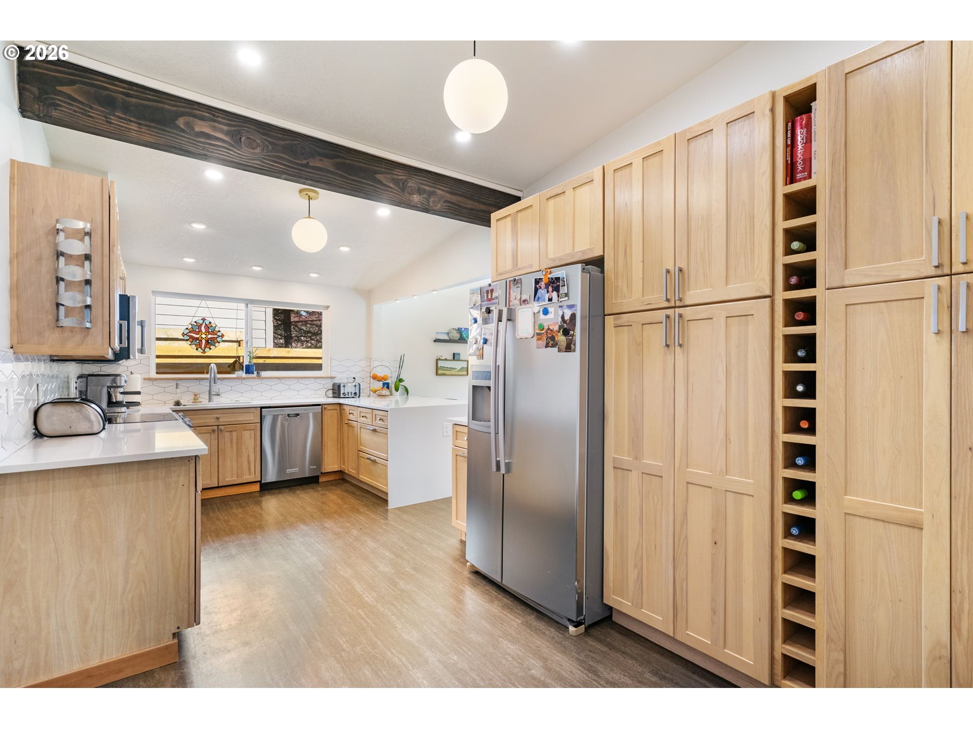 13410 Northwest Overton Street Portland, OR 97229 - Photo 18 of 48 a kitchen with stainless steel appliances a refrigerator and a cabinets