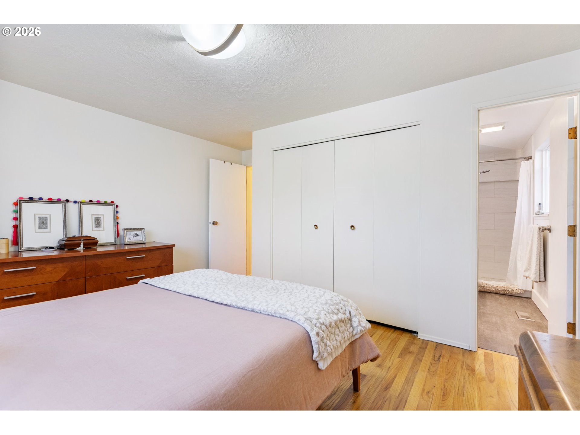 13410 Northwest Overton Street Portland, OR 97229 - Photo 23 of 48 a bedroom with a bed and a table