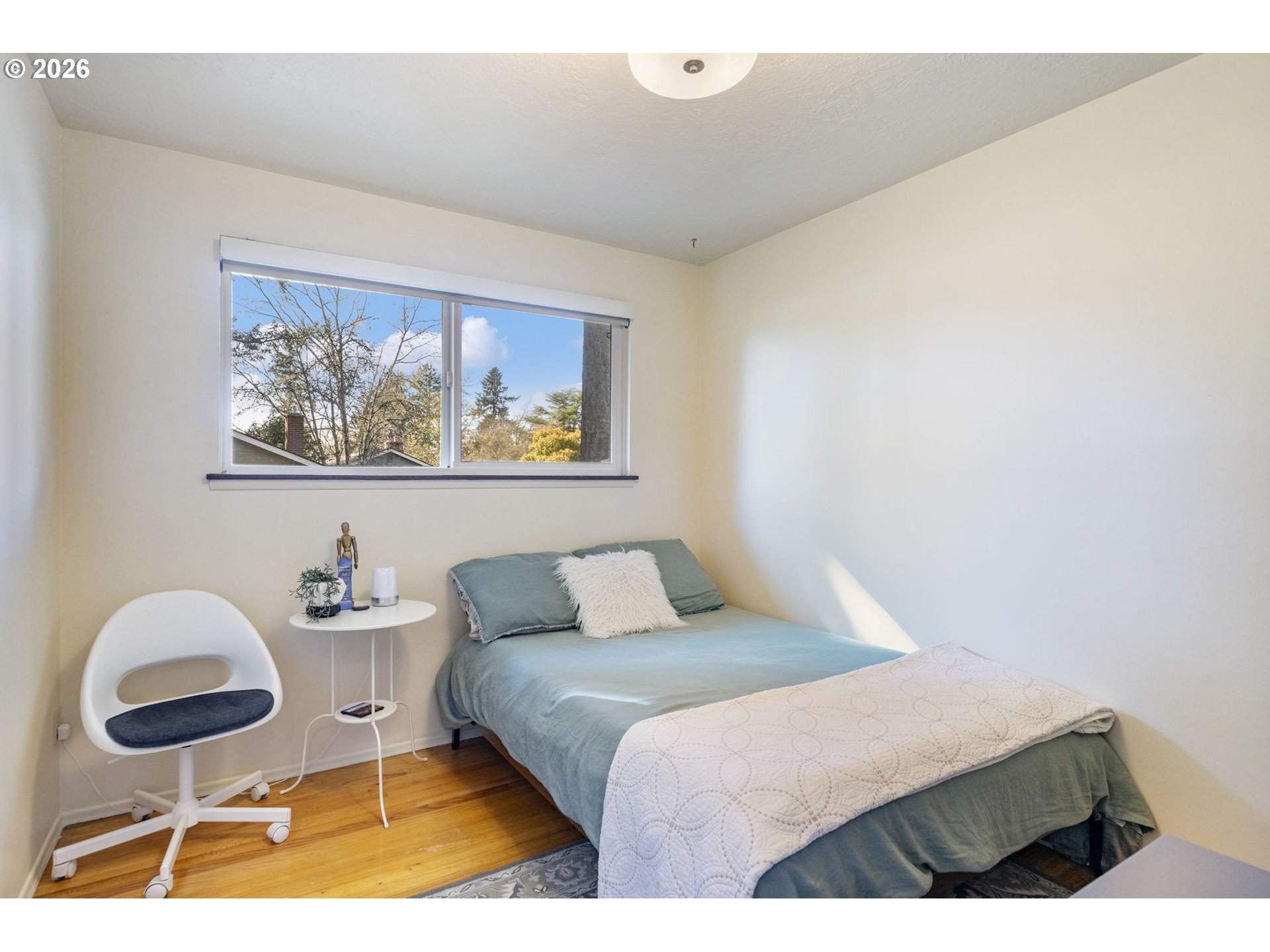 13410 Northwest Overton Street Portland, OR 97229 - Photo 27 of 48 a bedroom with a bed and painting on the wall