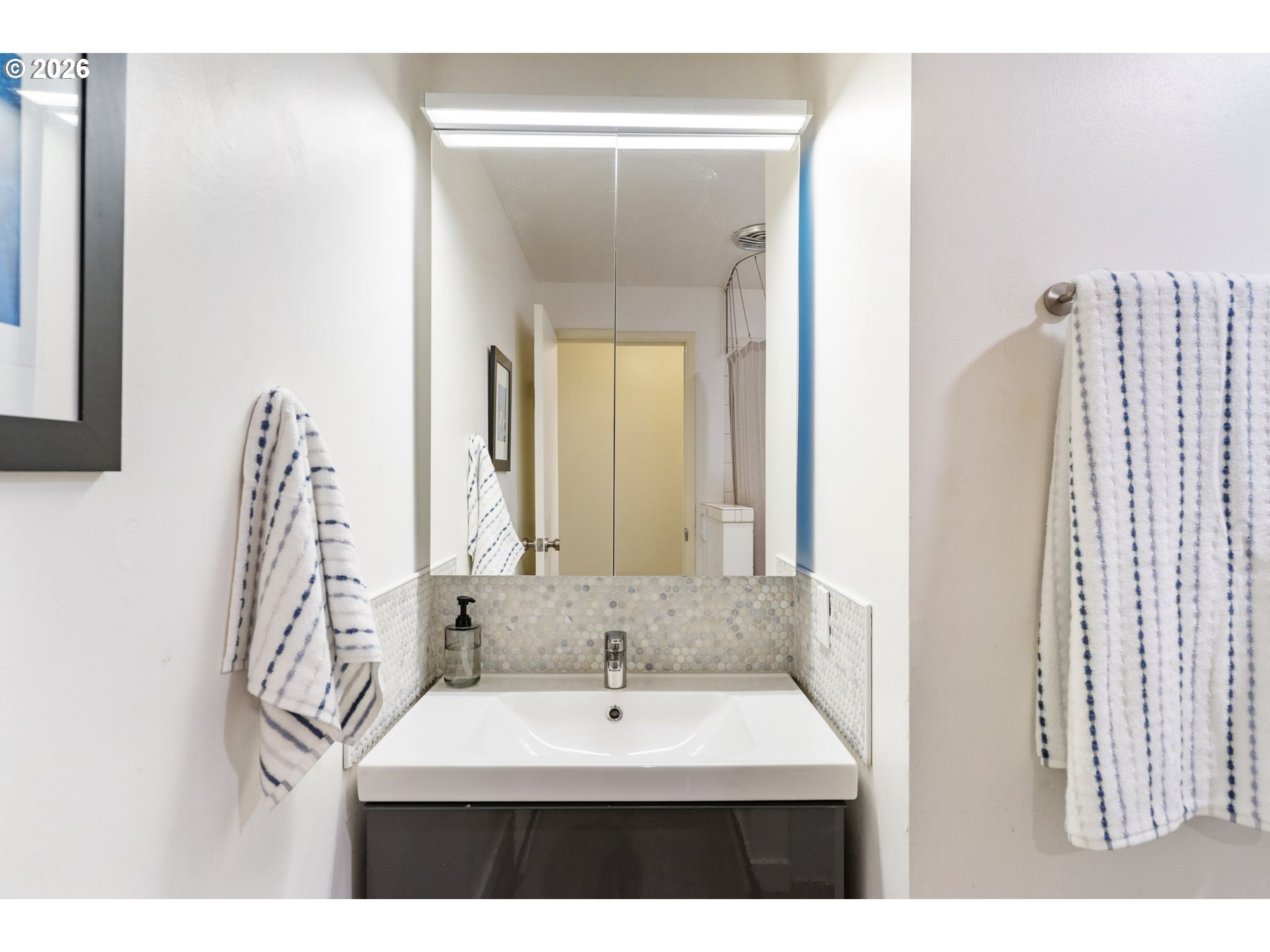 13410 Northwest Overton Street Portland, OR 97229 - Photo 29 of 48 a bathroom with a sink vanity and a mirror