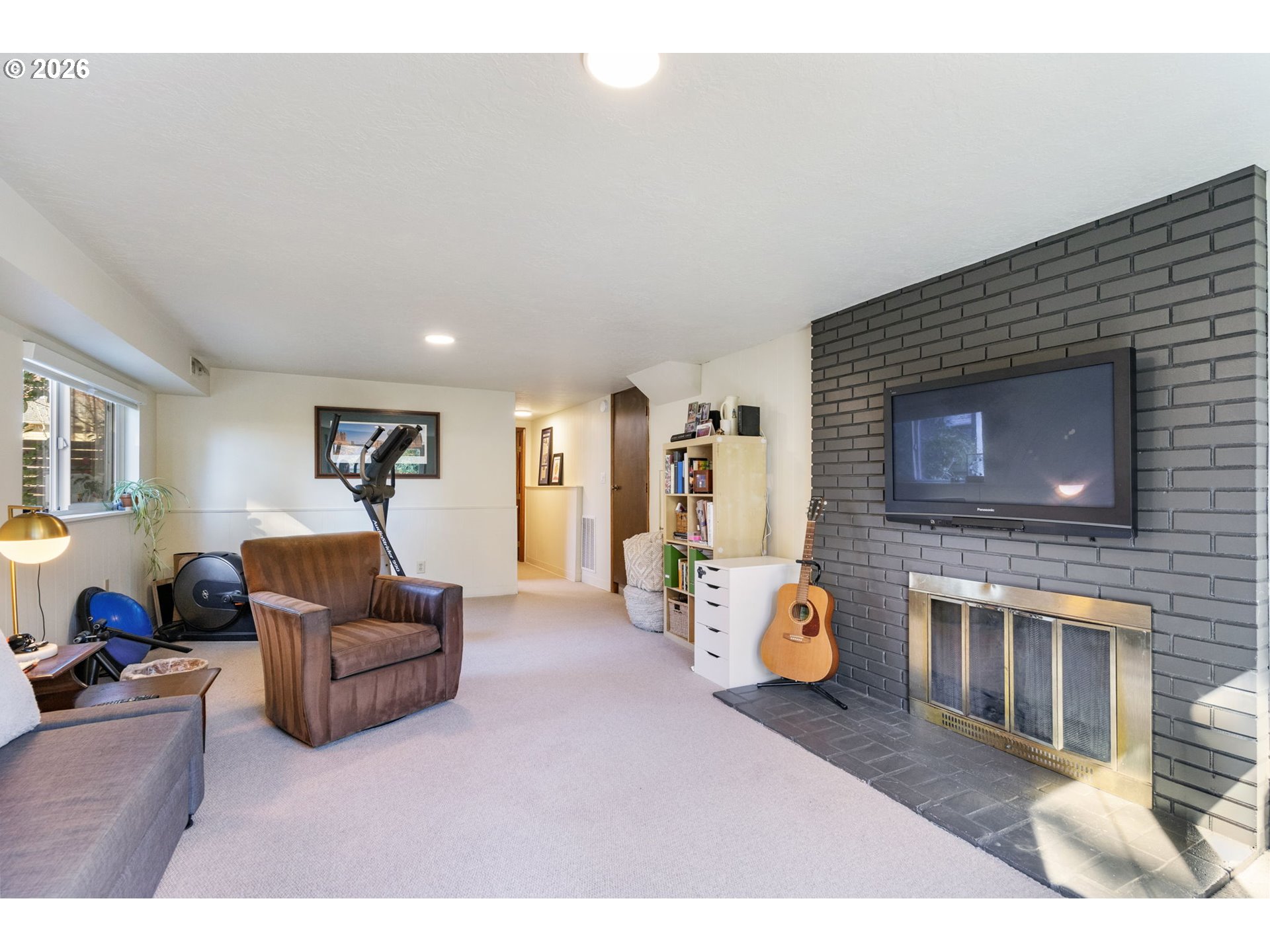 13410 Northwest Overton Street Portland, OR 97229 - Photo 32 of 48 a living room with furniture and a fireplace