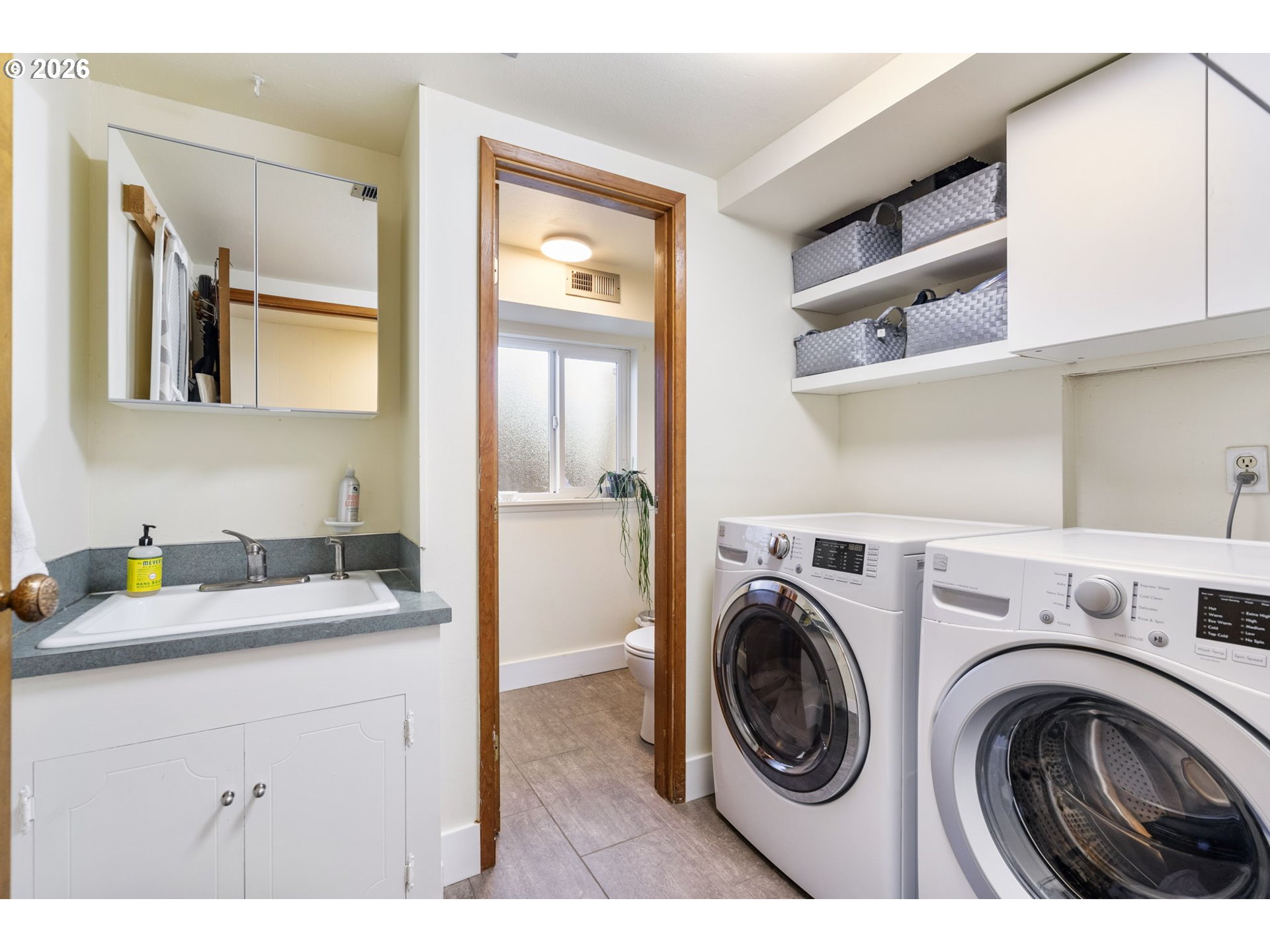 13410 Northwest Overton Street Portland, OR 97229 - Photo 35 of 48 a utility room with sink dryer and washer