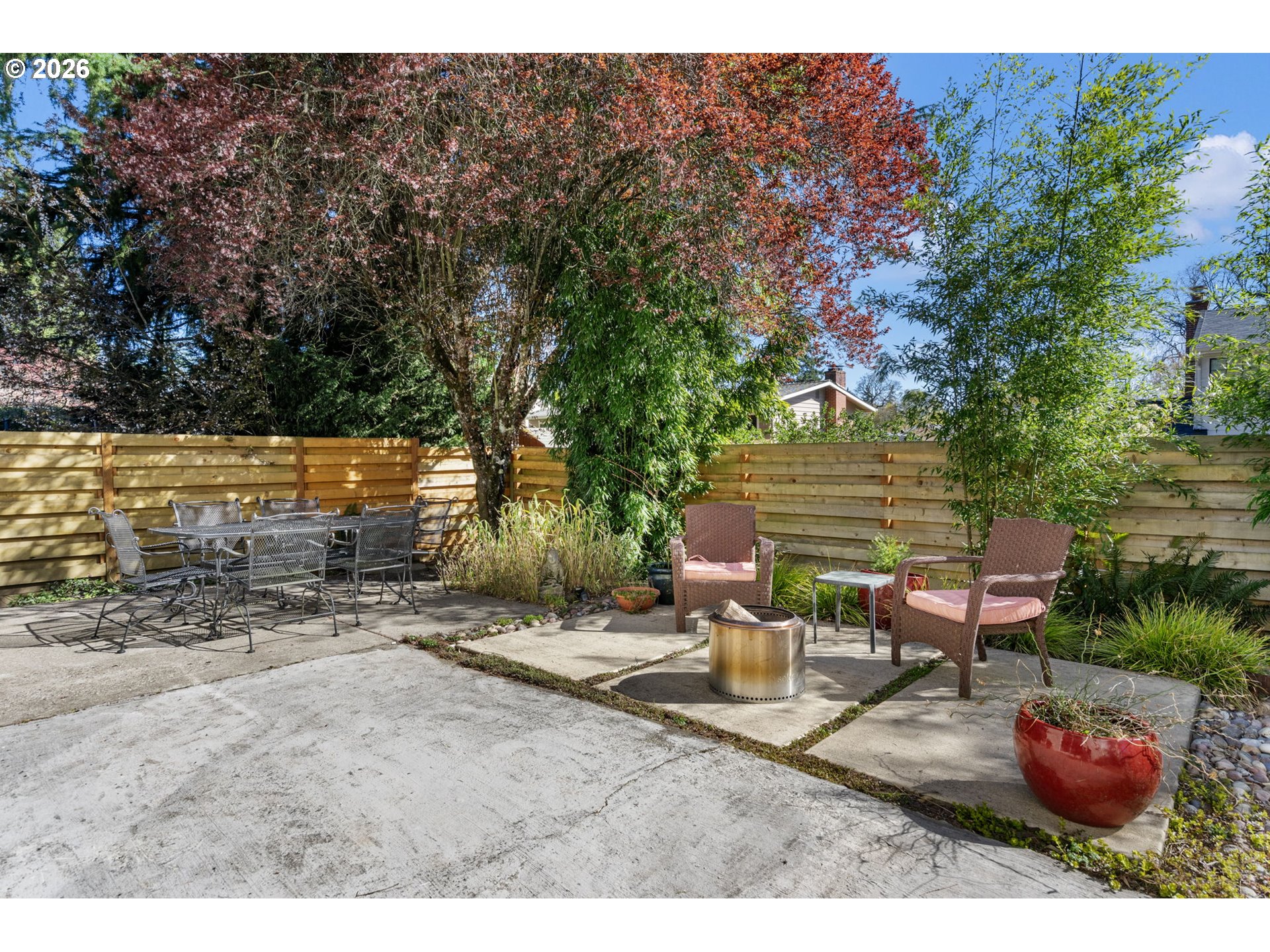 13410 Northwest Overton Street Portland, OR 97229 - Photo 37 of 48 a view of a patio with chairs and potted plants