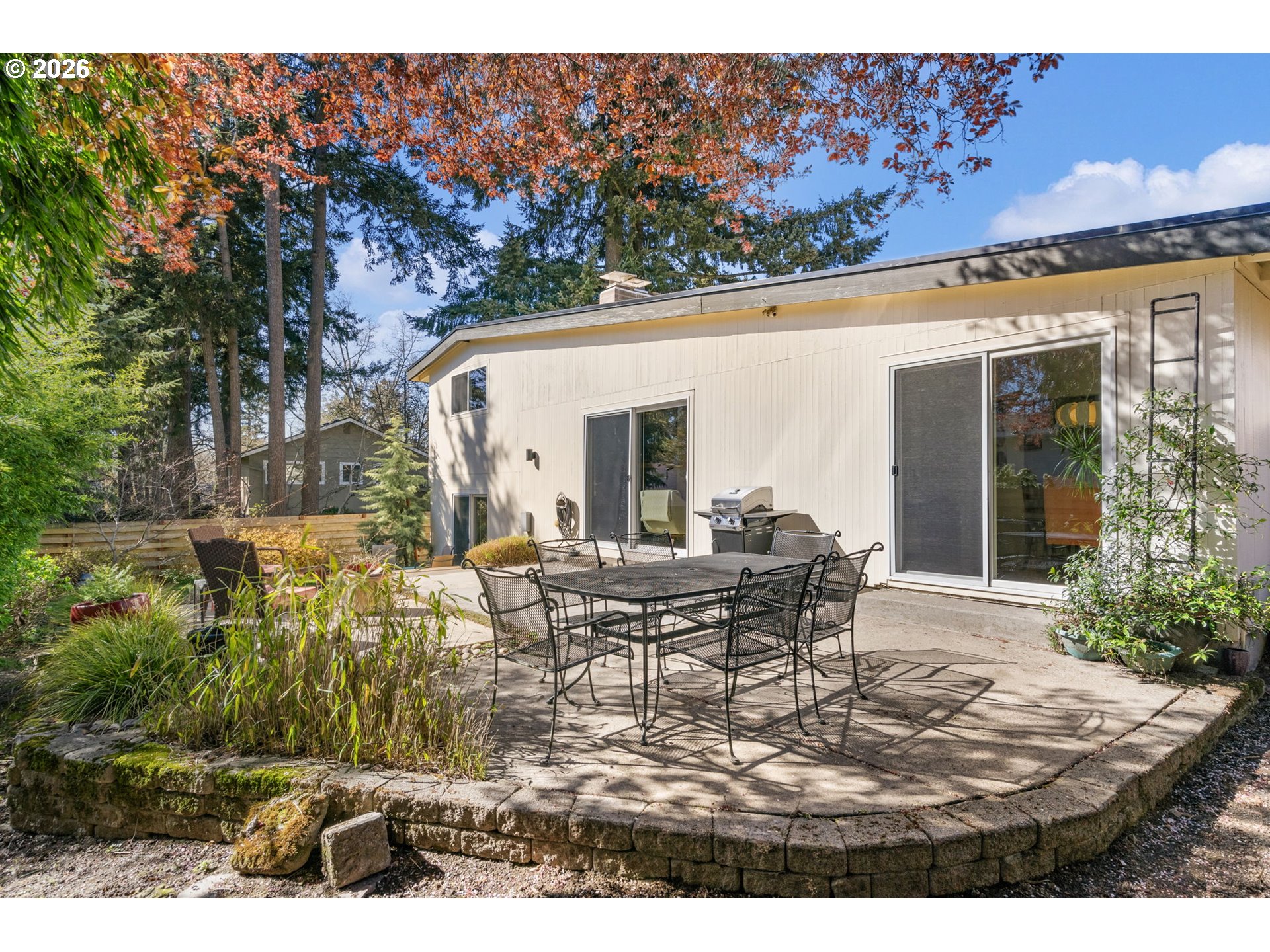 13410 Northwest Overton Street Portland, OR 97229 - Photo 38 of 48 a view of house with backyard and outdoor seating