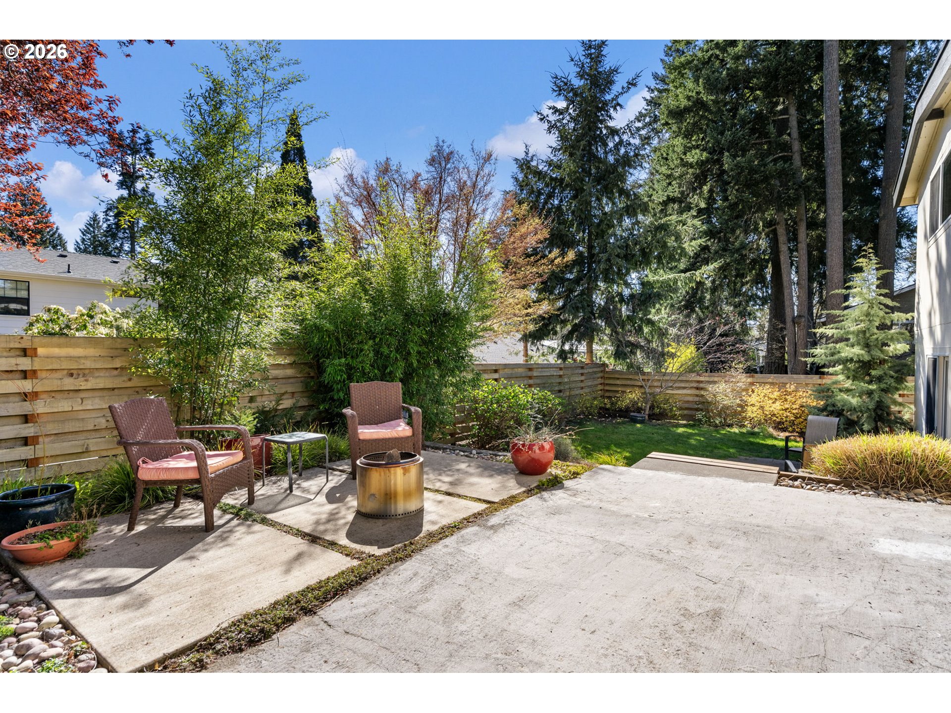 13410 Northwest Overton Street Portland, OR 97229 - Photo 40 of 48 a backyard of a house with table and chairs