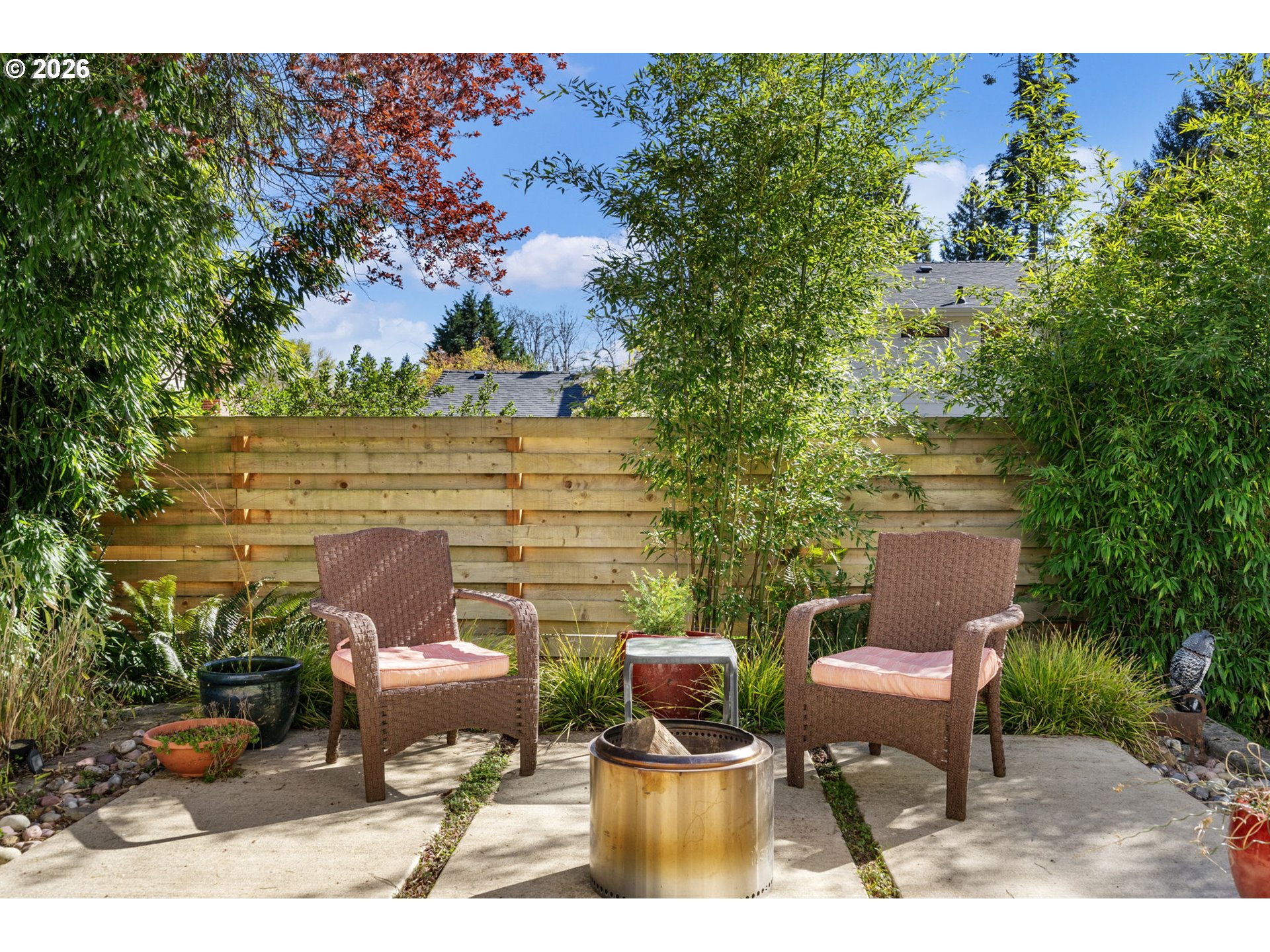 13410 Northwest Overton Street Portland, OR 97229 - Photo 41 of 48 a couple of chairs sitting in a backyard with large trees