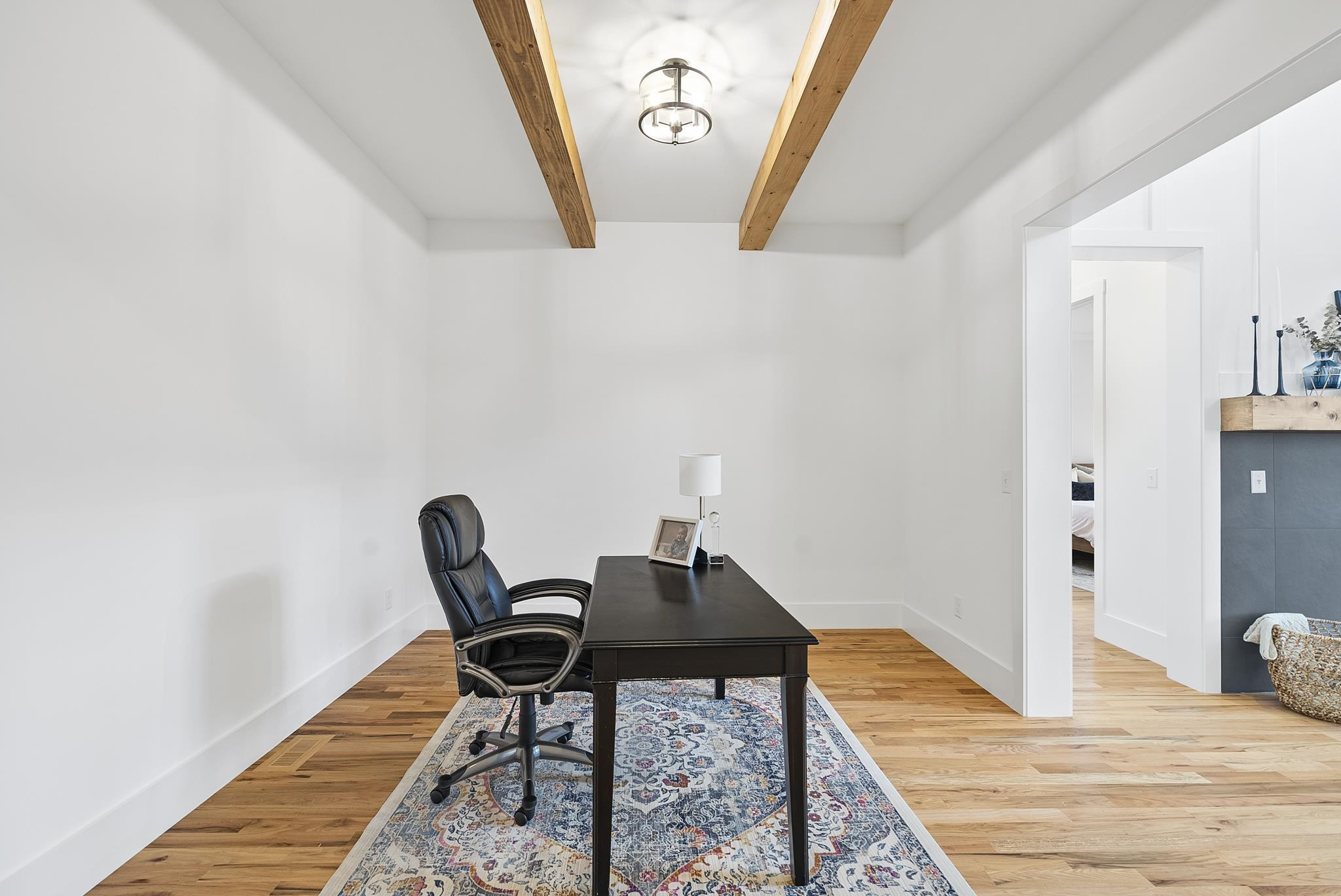 1004 Harrison Ridge Road Wake Forest, NC 27587 - Photo 33 of 48 a workspace with wooden floor and a rug