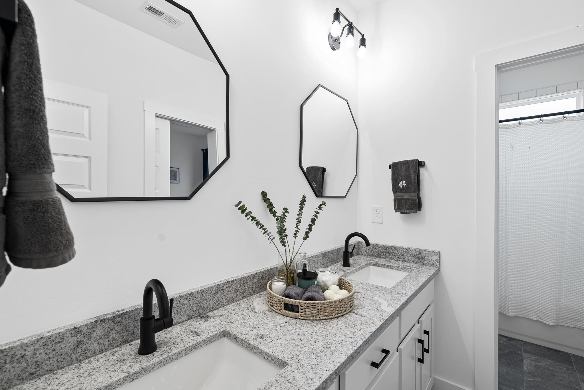 1004 Harrison Ridge Road Wake Forest, NC 27587 - Photo 38 of 48 a bathroom with a sink and a mirror