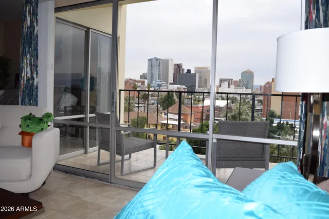 a view of a balcony with chairs
