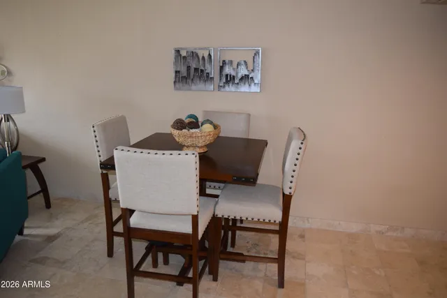 a dining room with furniture and window