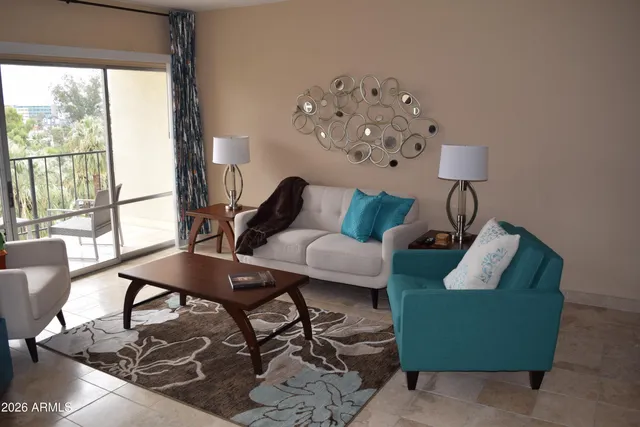 a living room with furniture and a large window