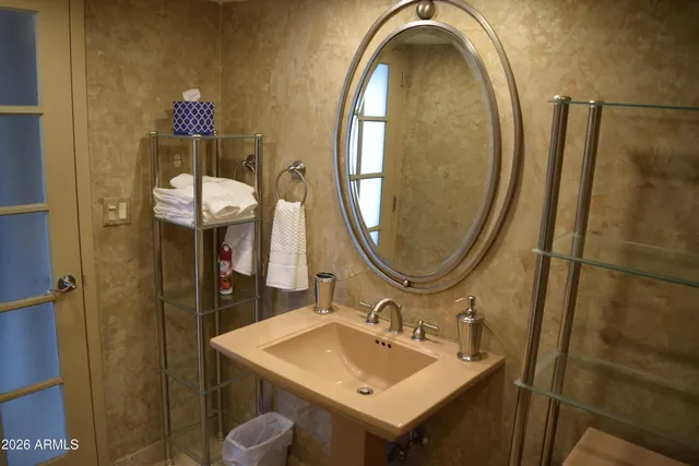 a bathroom with a sink and a mirror
