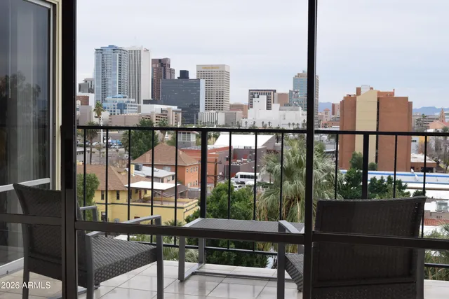 a view of a balcony with city view