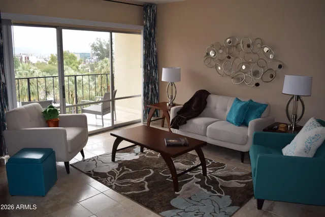 a living room with furniture and a large window