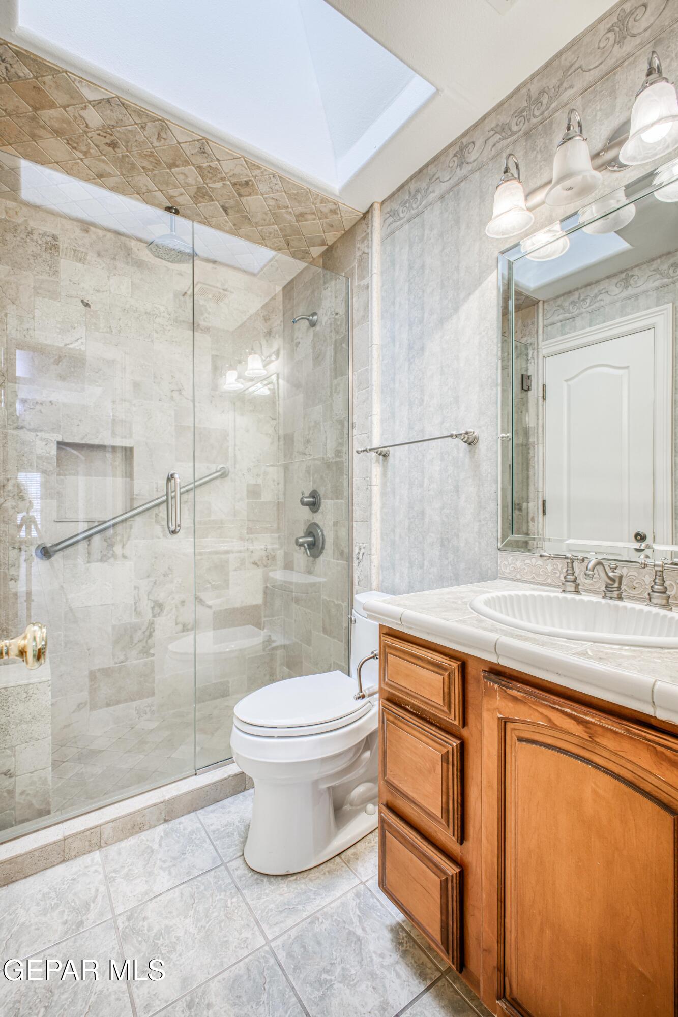 6565 Eagle Ridge Drive El Paso, TX 79912 - Photo 20 of 60 a bathroom with a sink toilet and shower