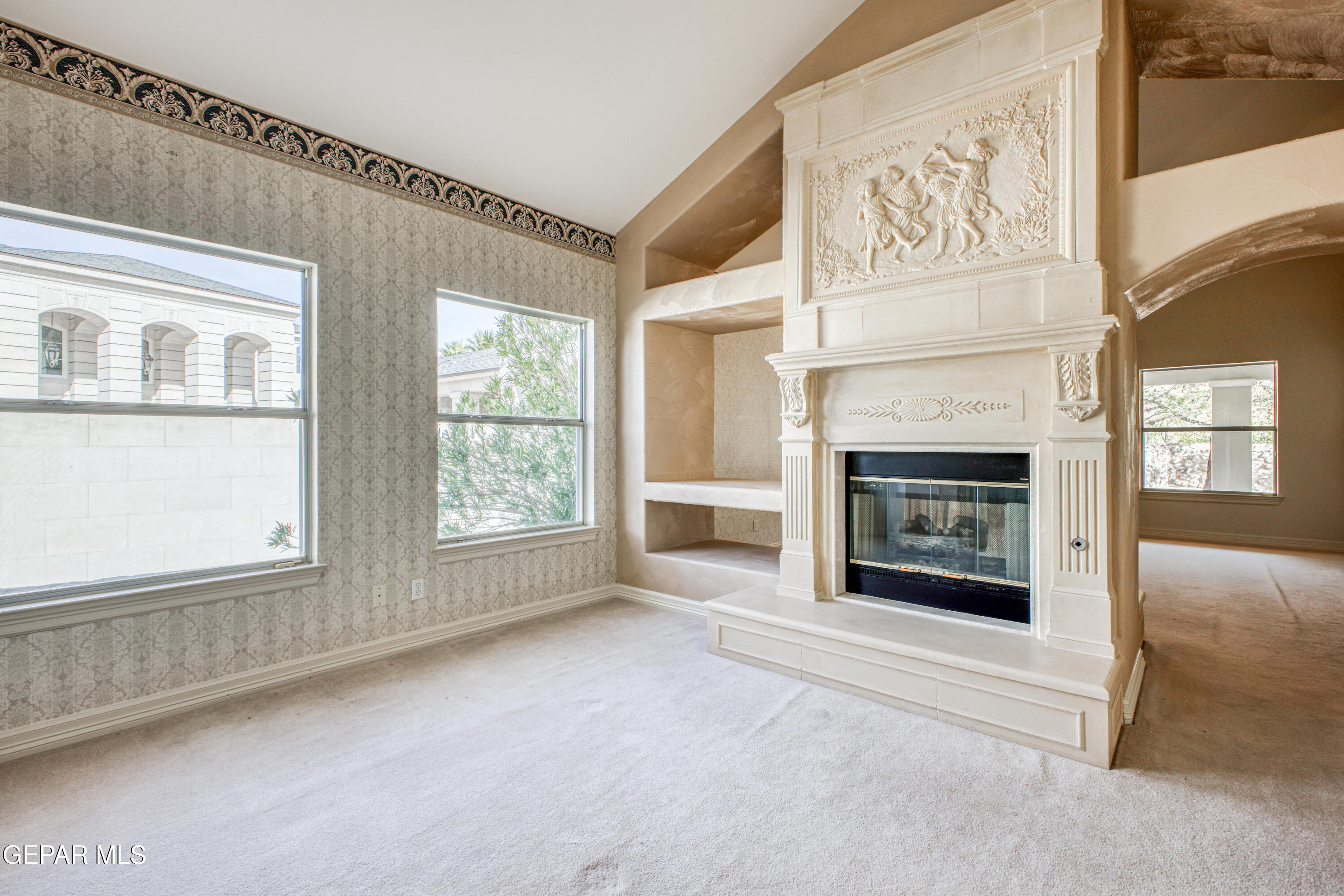6565 Eagle Ridge Drive El Paso, TX 79912 - Photo 26 of 60 a view of an empty room with a fireplace