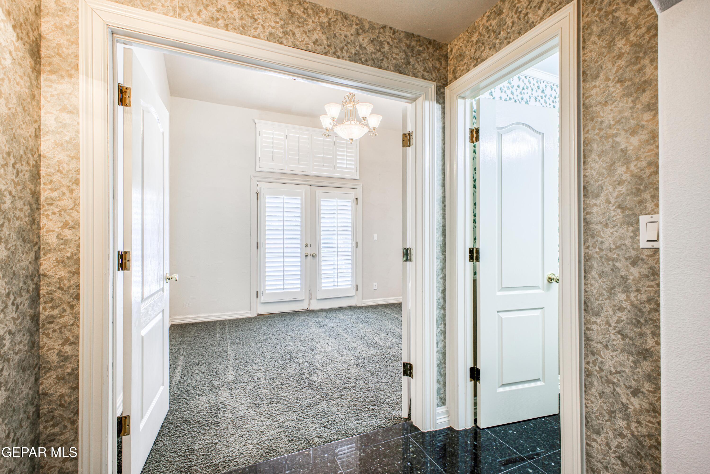 6565 Eagle Ridge Drive El Paso, TX 79912 - Photo 39 of 60 a view of a bathroom with a glass door