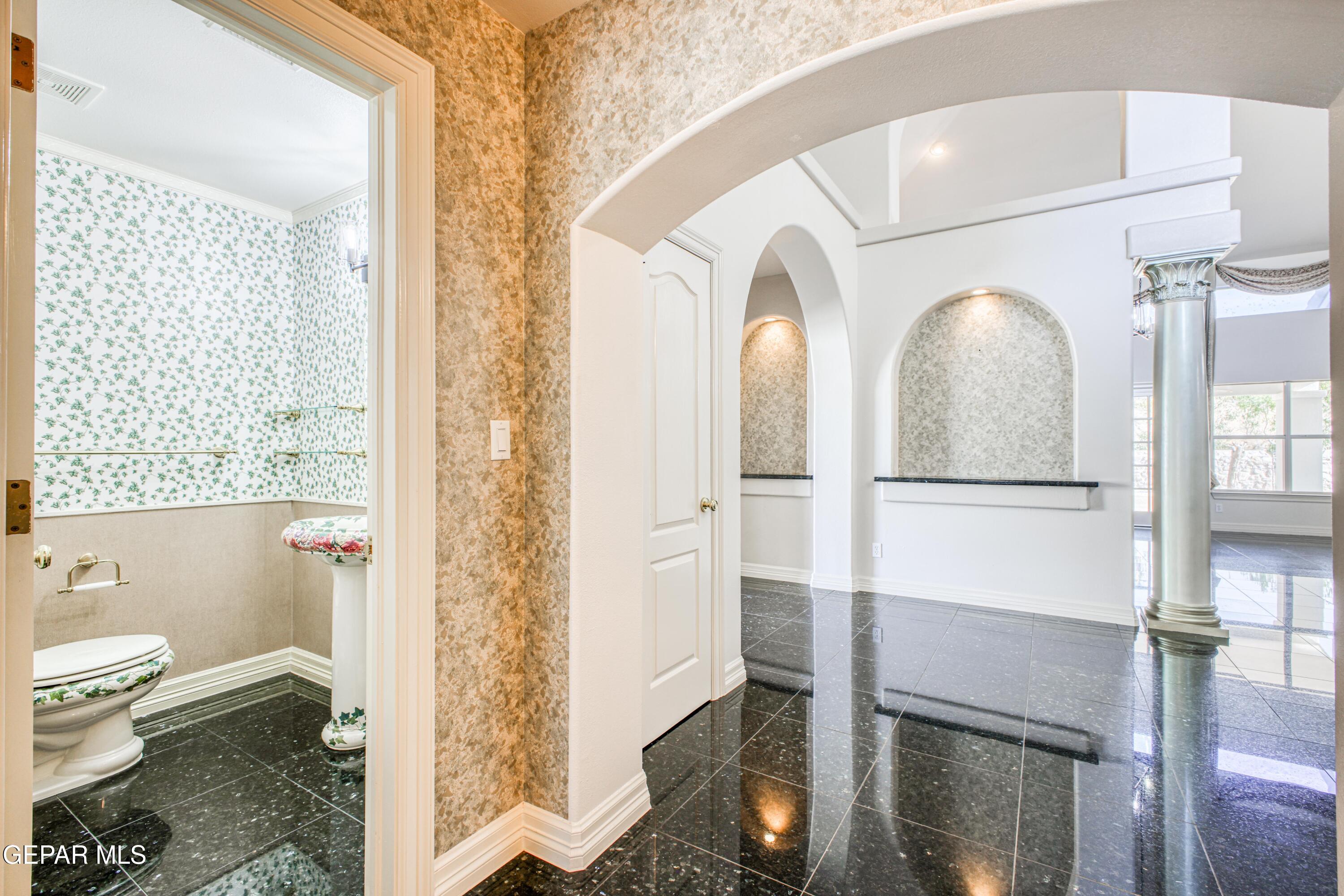 6565 Eagle Ridge Drive El Paso, TX 79912 - Photo 40 of 60 a bathroom with a double vanity sink and a mirror