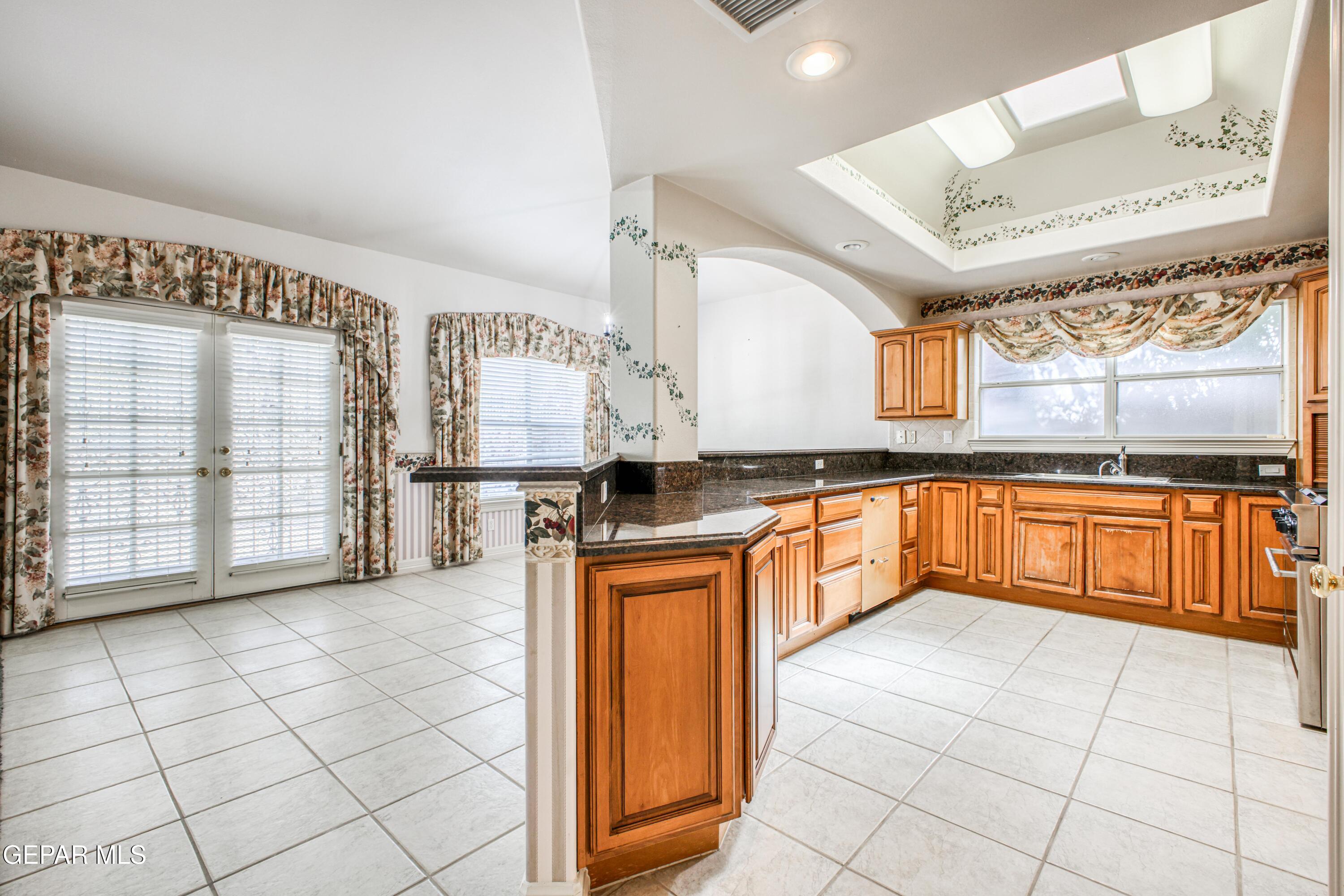 6565 Eagle Ridge Drive El Paso, TX 79912 - Photo 44 of 60 a large kitchen with a stove a sink dishwasher and a refrigerator
