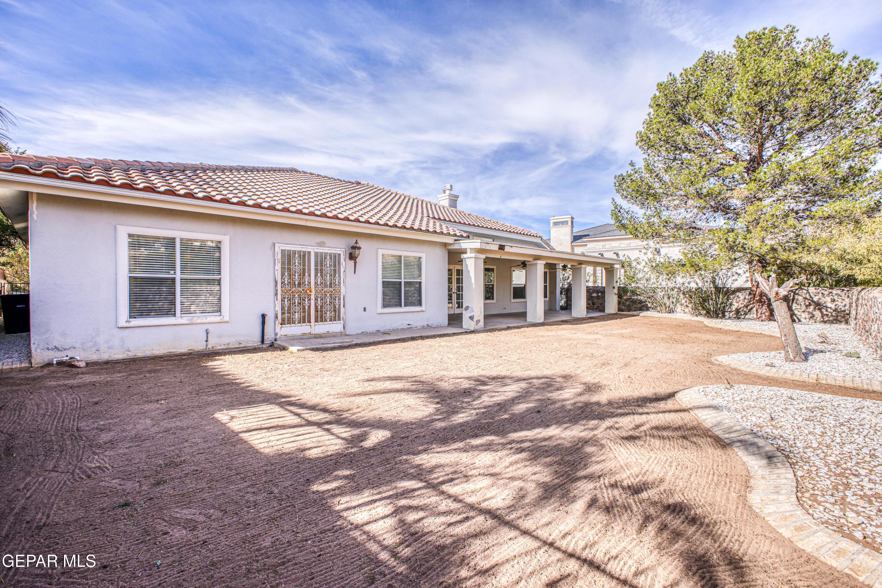 6565 Eagle Ridge Drive El Paso, TX 79912 - Photo 57 of 60 a house with yard in front of it