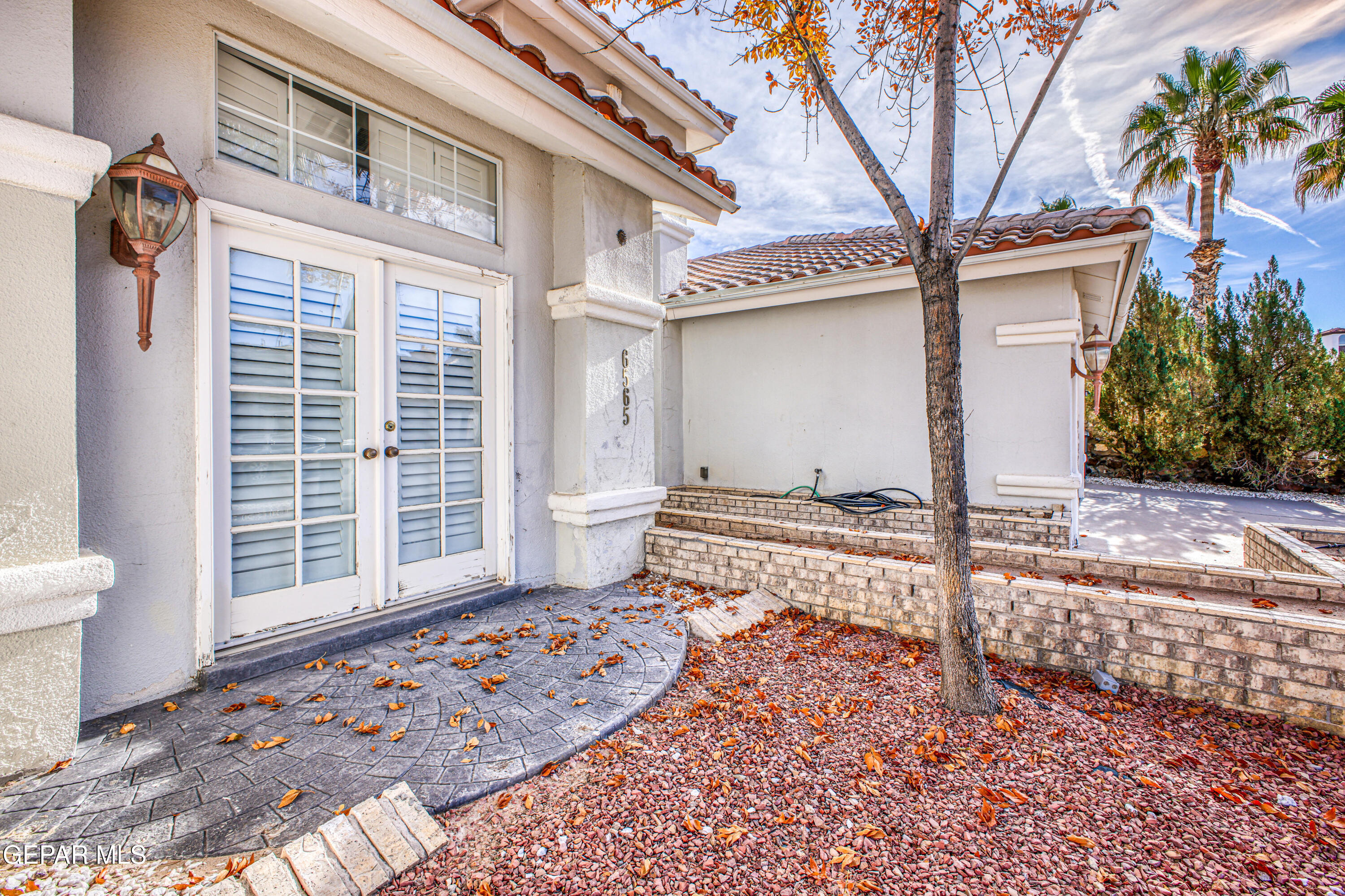 6565 Eagle Ridge Drive El Paso, TX 79912 - Photo 7 of 60 a front view of a house with a yard